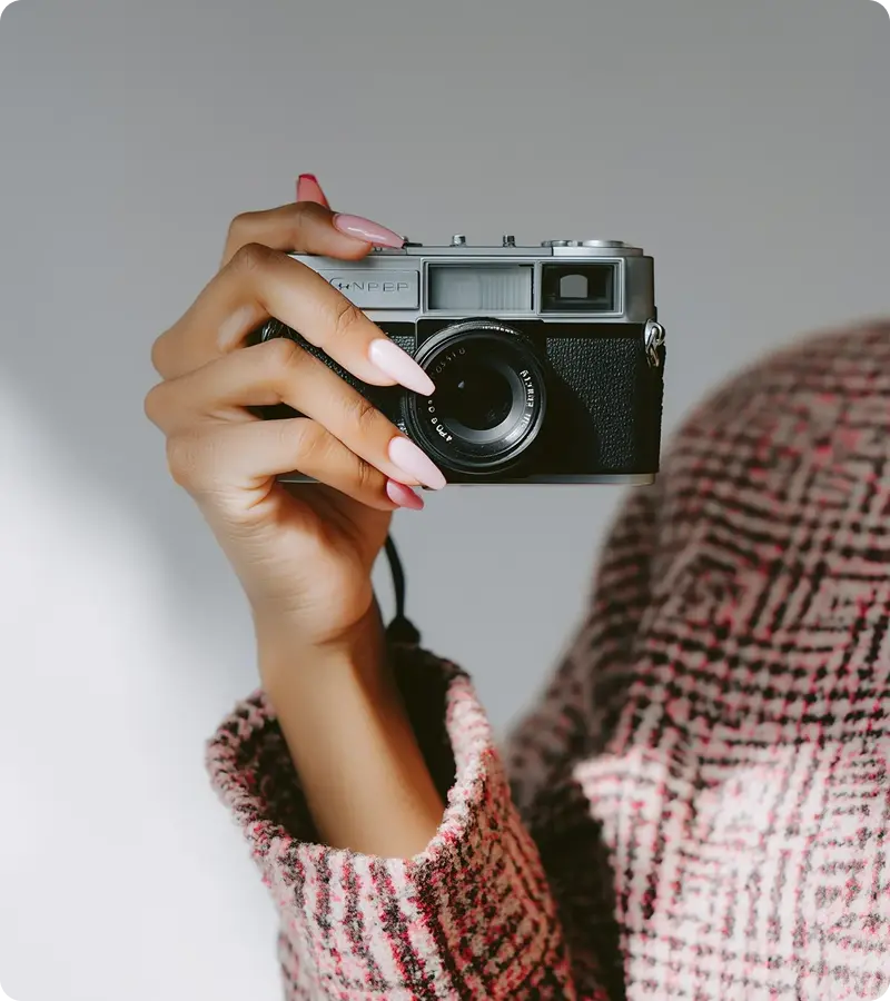 Hand holding vintage camera